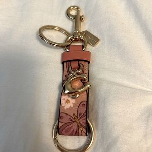 Coach butterfly trigger snap bag charm